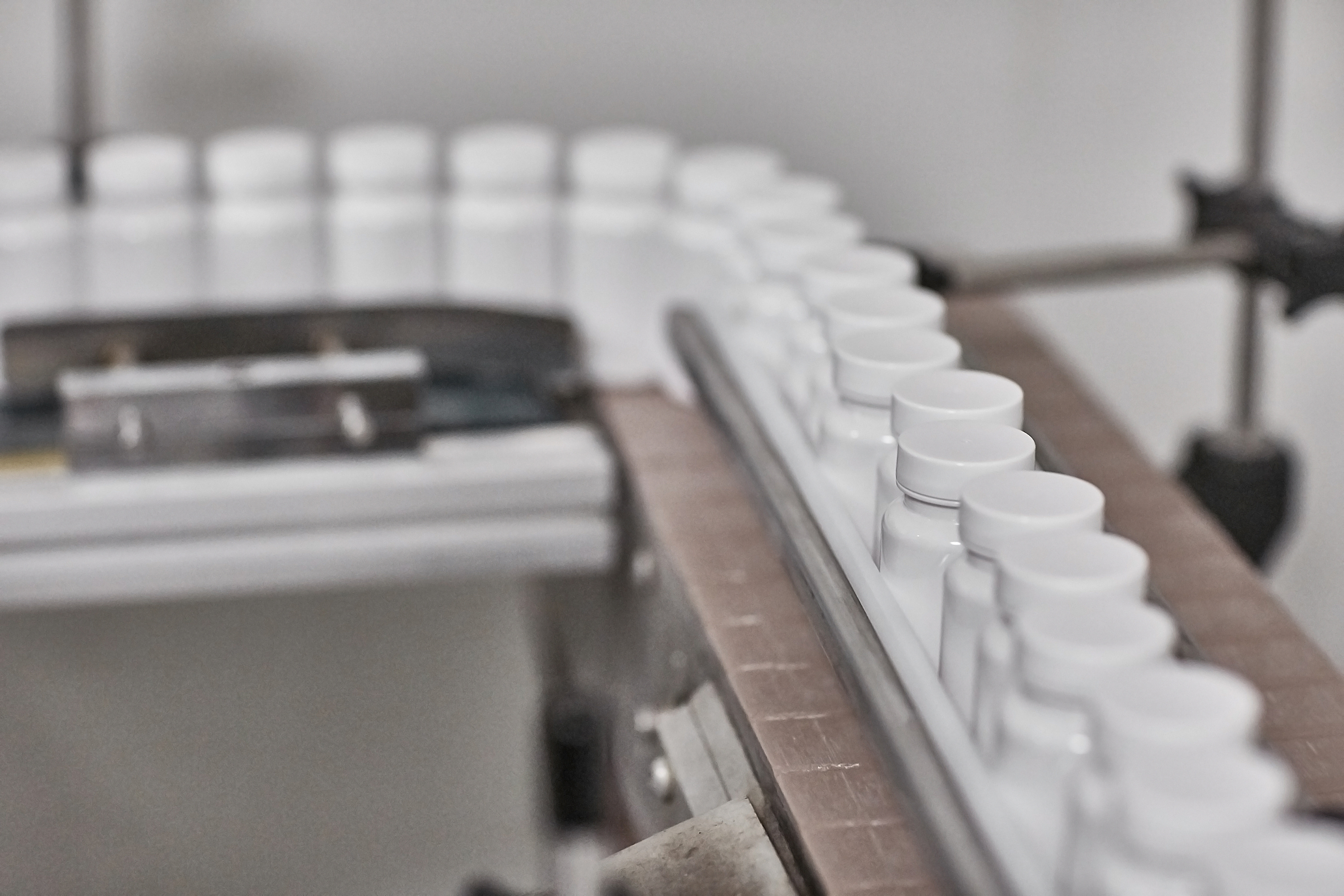 Bottles moving along a Protrition Labs packaging line